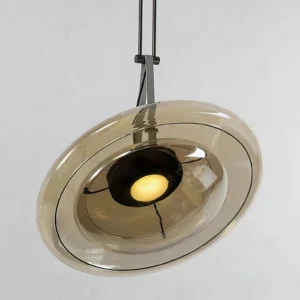 Close-up detail of Futura pendant lamp base showing integrated LED light source and black metal hardware