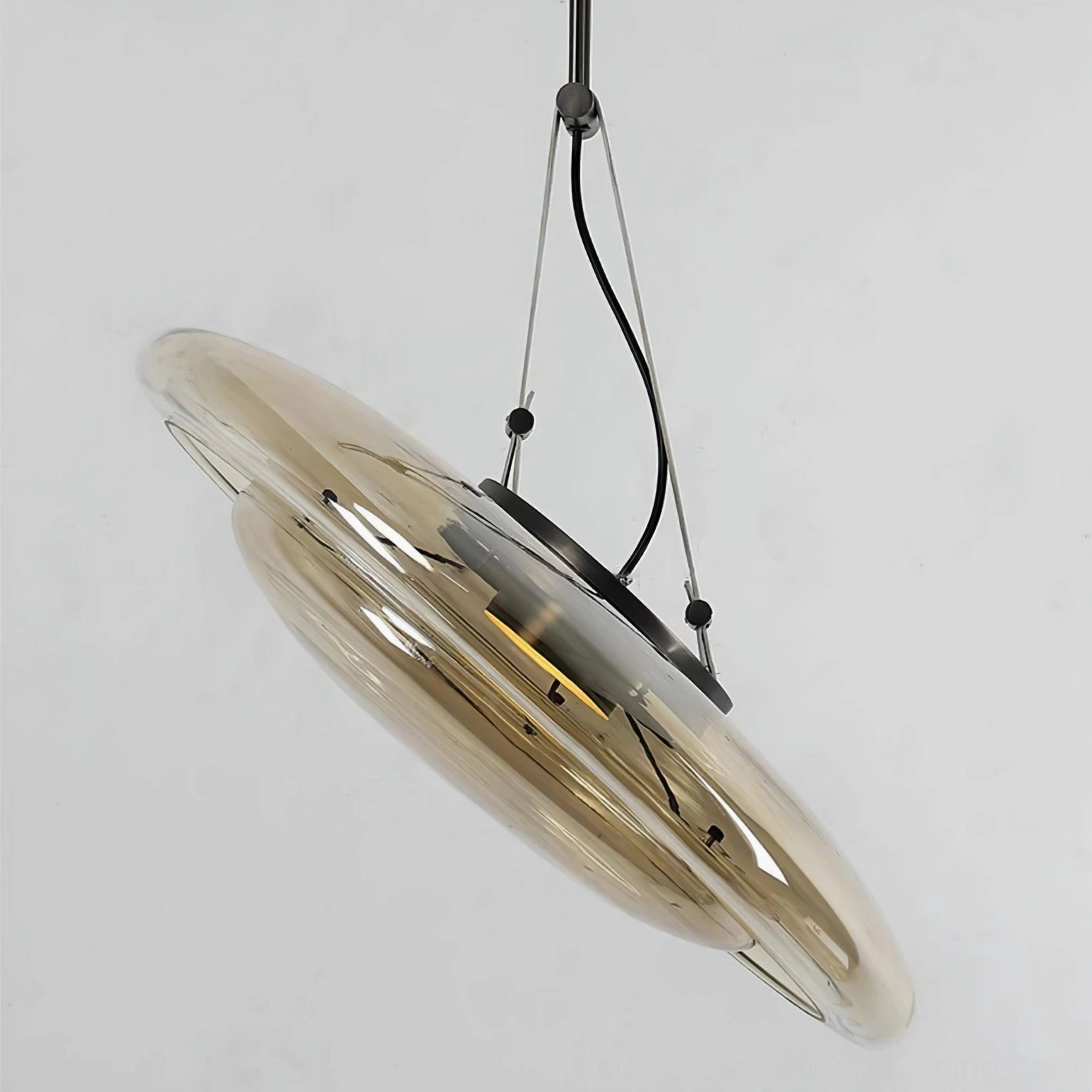 Side profile view of Futura glass pendant lamp showing minimalist disc design and leather suspension cord