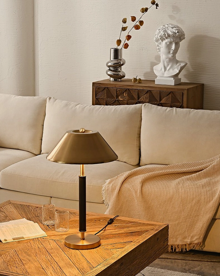 Table lamp styled with sculptural bust and decorative vase, contemporary home accent
