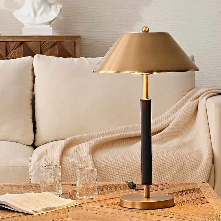 Black and gold minimalist table lamp side profile view, mid-century modern lighting