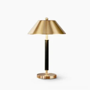 Futurist black and brushed gold modern table lamp, frontal studio view