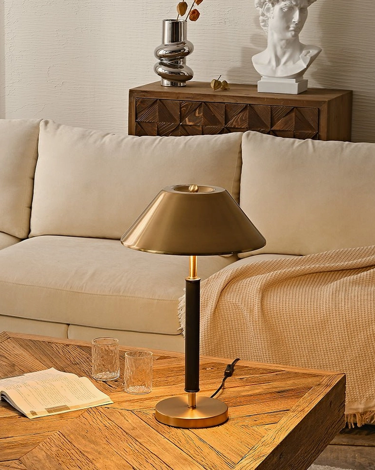 Contemporary table lamp next to sofa with knit throw, luxury living room lighting