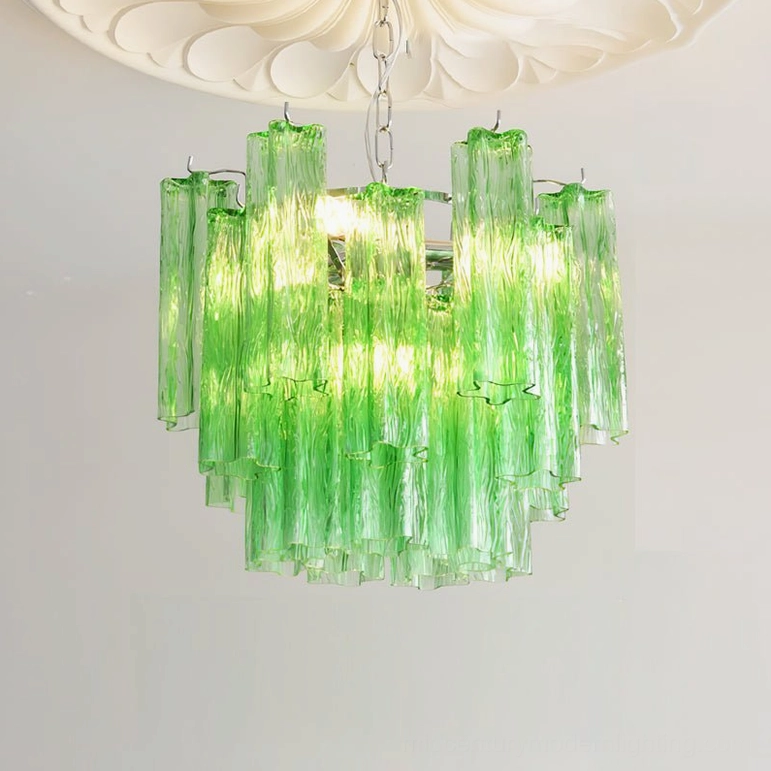 Gabriella tiered glass chandelier light blue variant hanging in minimalist interior with modern furnishings