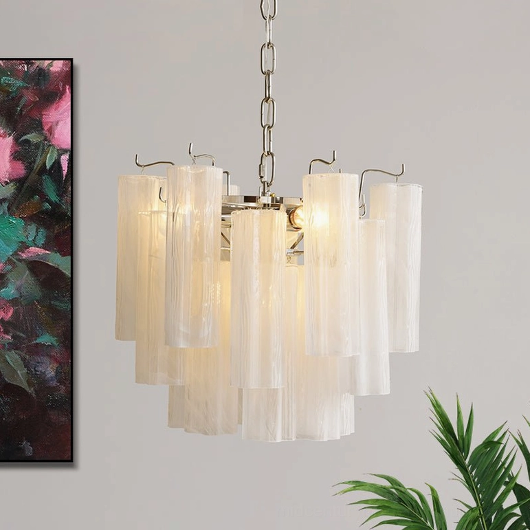White Gabriella tiered fluted glass chandelier with polished chrome chain hanging in modern interior corner