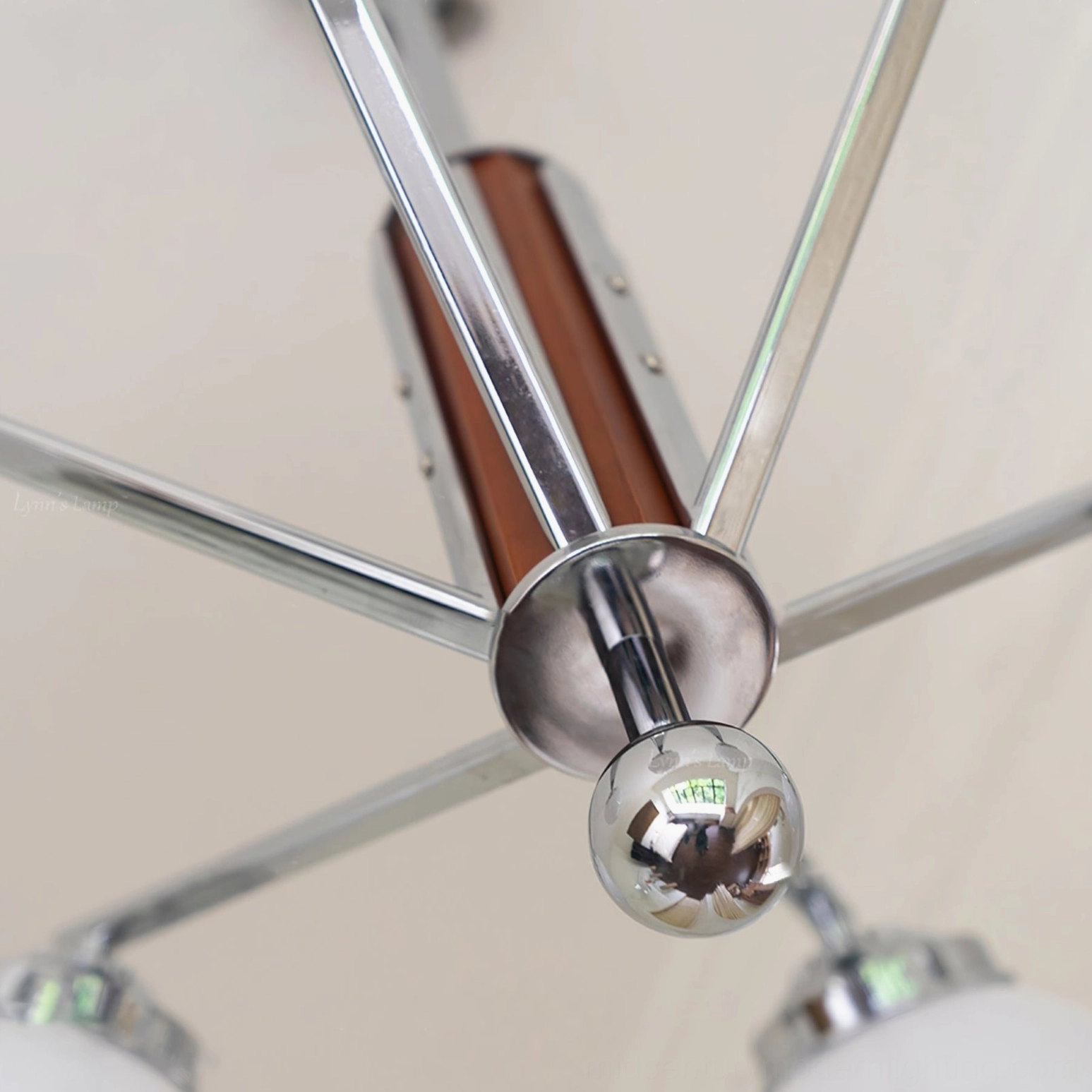 Gaetano sputnik chandelier chrome metal arms detail shot showing precision engineering and walnut wood accent trim