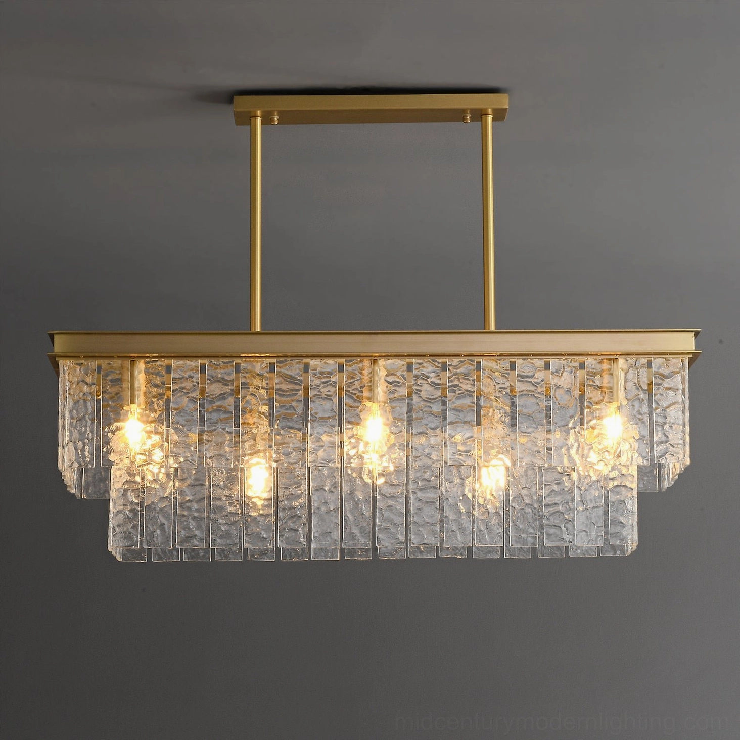 Close-up detail of Gaia chandelier showing exposed warm bulbs and textured rippled glass panels