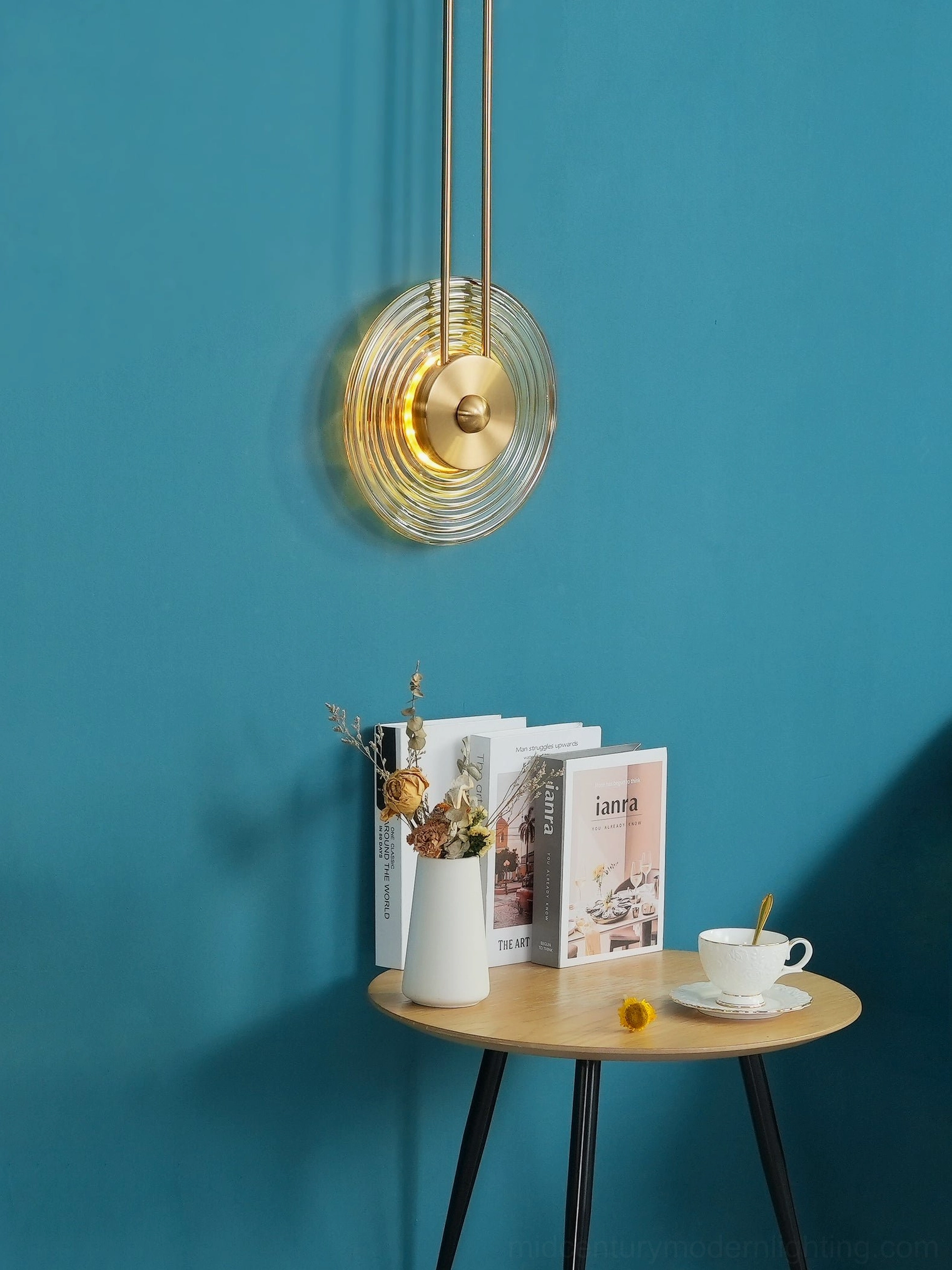 Gaia wall sconce geometric disc configuration shadow light effect
