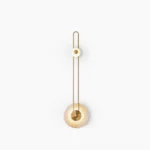 Gaia geometric wall sconce front view copper and black finish with amber glass disc