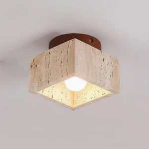 Gaila travertine flush mount ceiling light close-up showing natural stone pores and E27 bulb detail