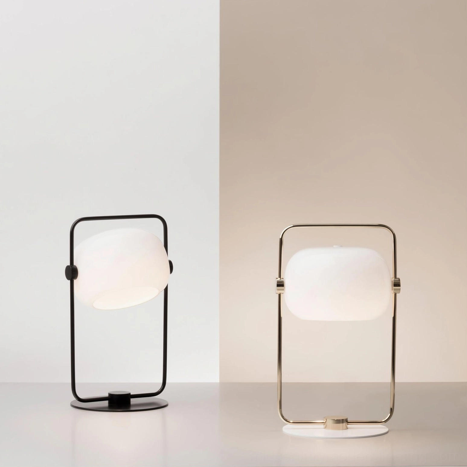 Black and gold Galet table lamps side by side, contrasting metal finish finishes