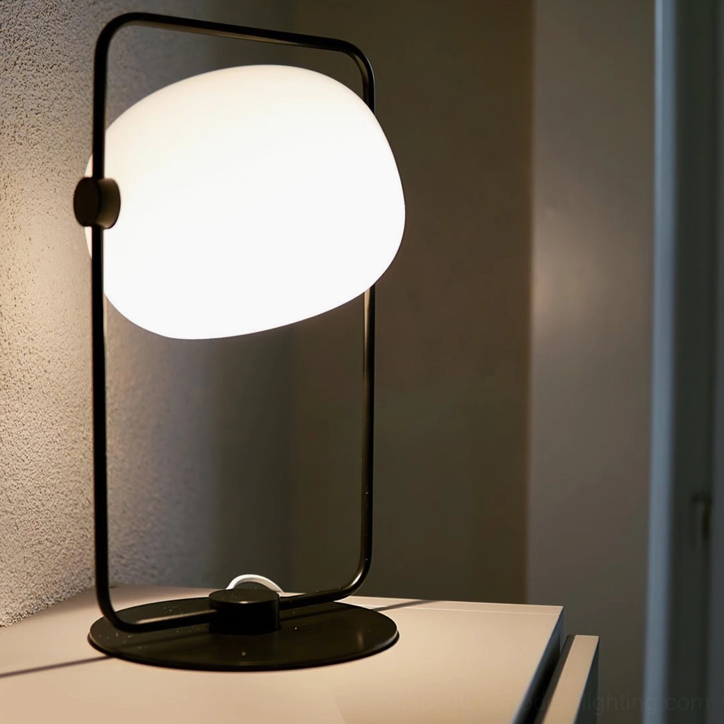 Modern minimalist table lamp in black or gold finish, mid-century inspired design