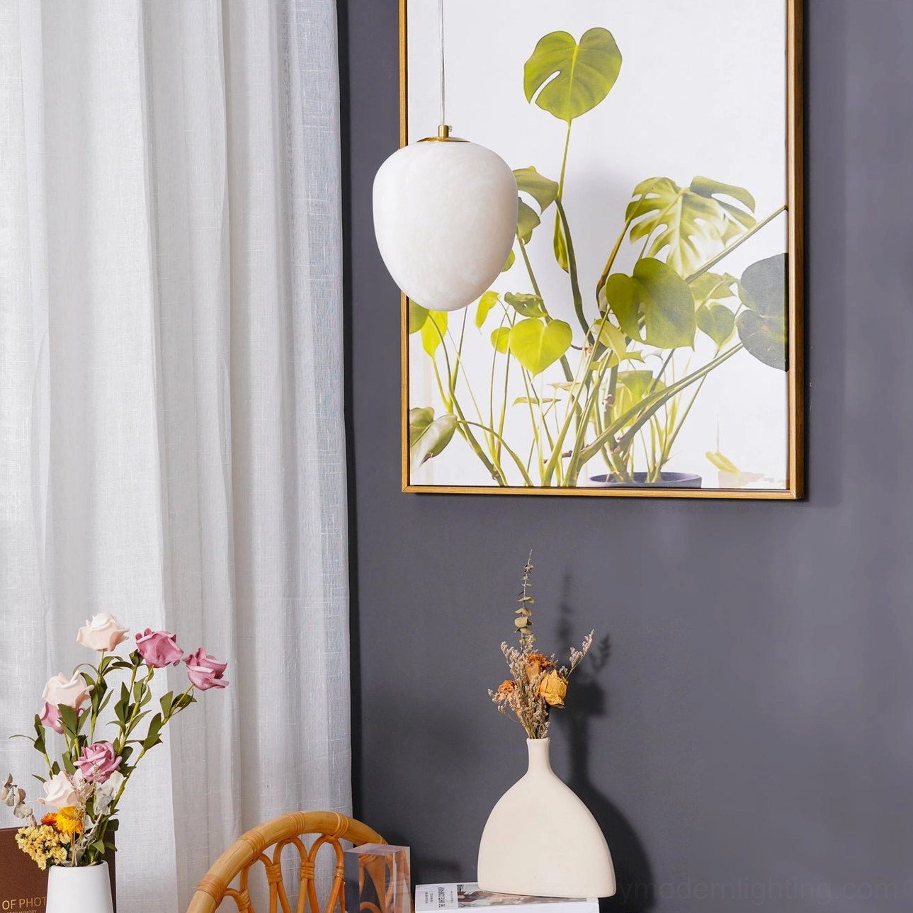 Galet alabaster pendant shadow cast on wall creating sculptural light pattern