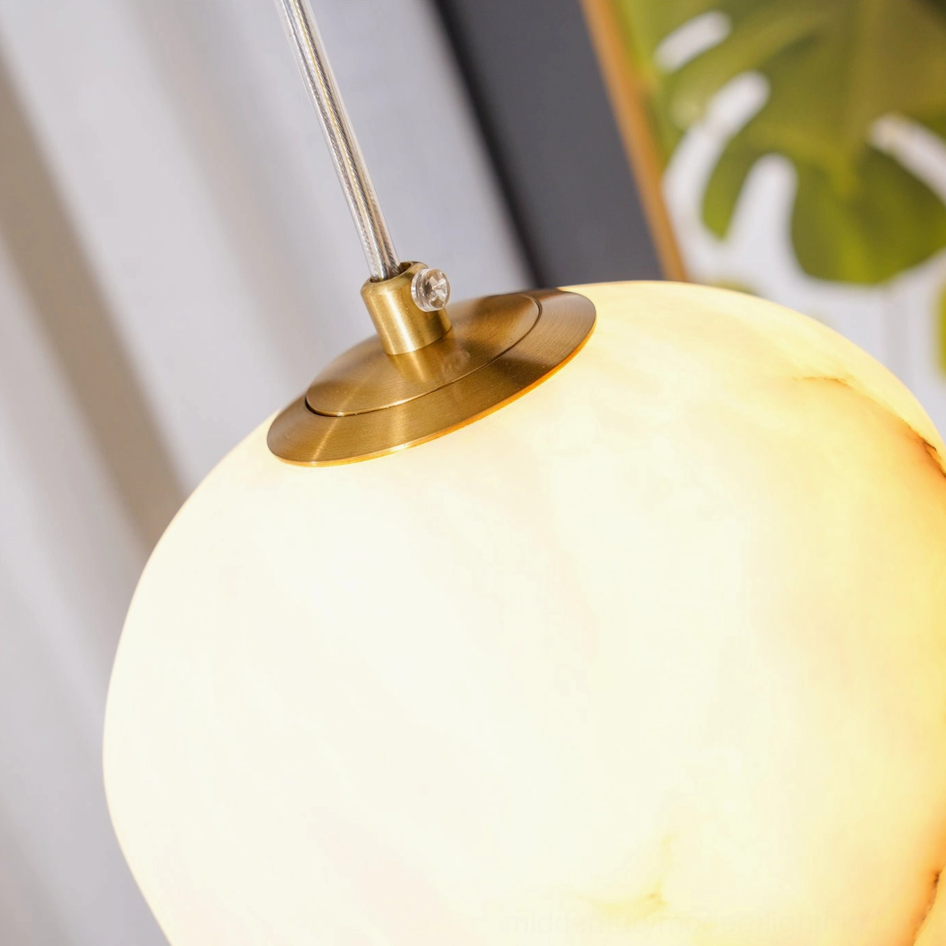 Galet alabaster pendant translucent stone capturing natural daylight