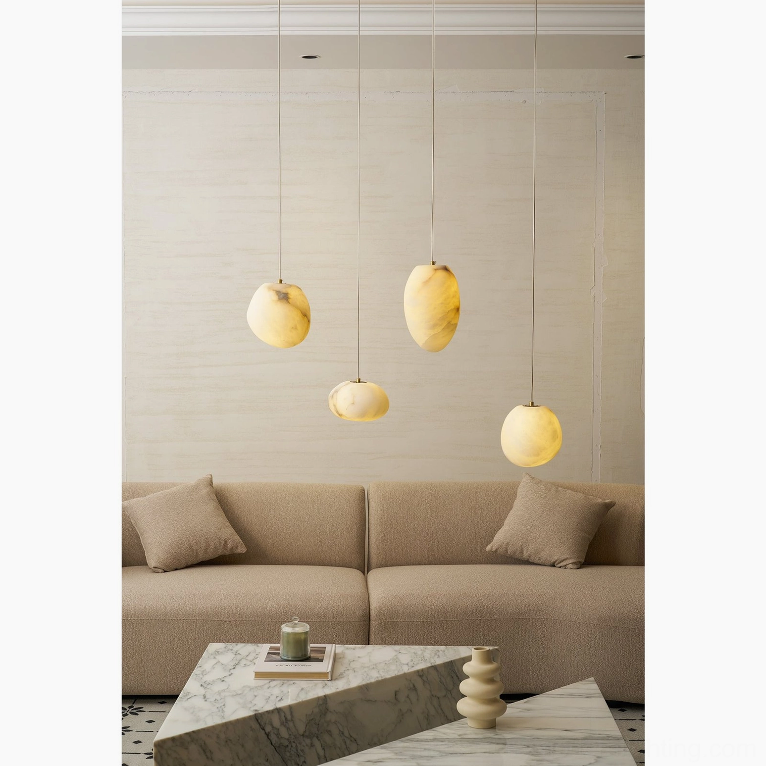 Galet alabaster pendant lamps suspended at varied heights in Nordic minimalist interior