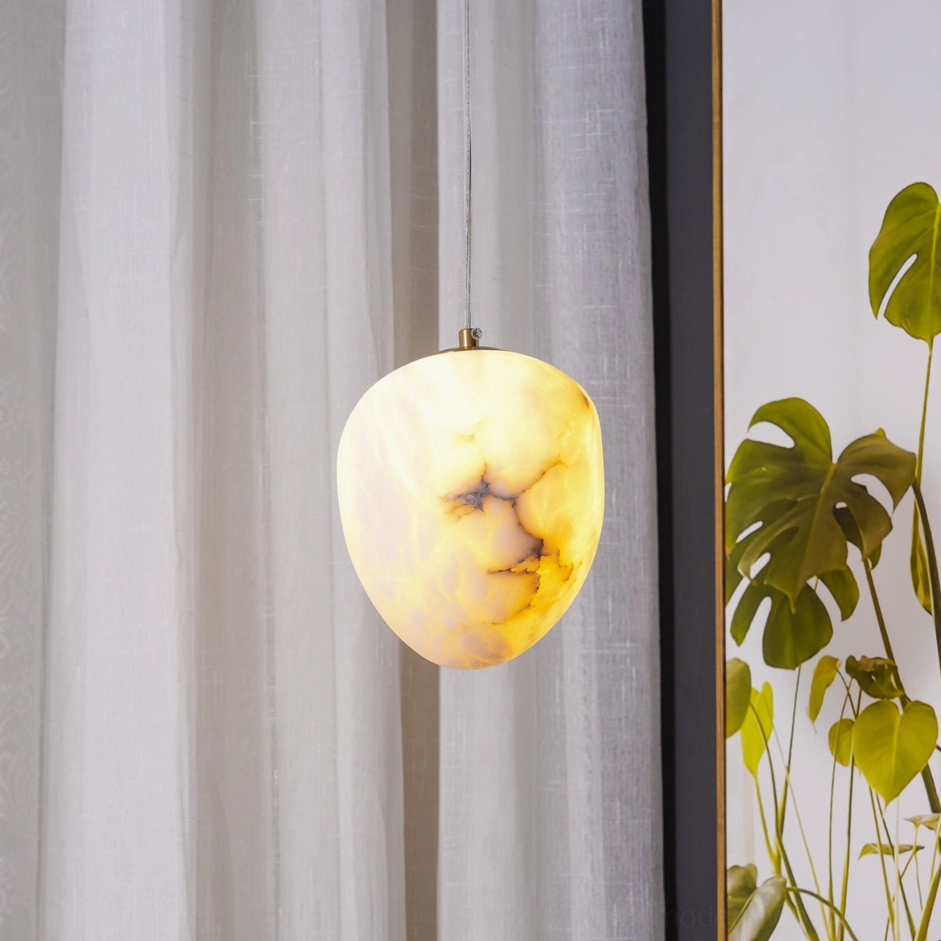 Galet alabaster pendant paired with modern interior design elements
