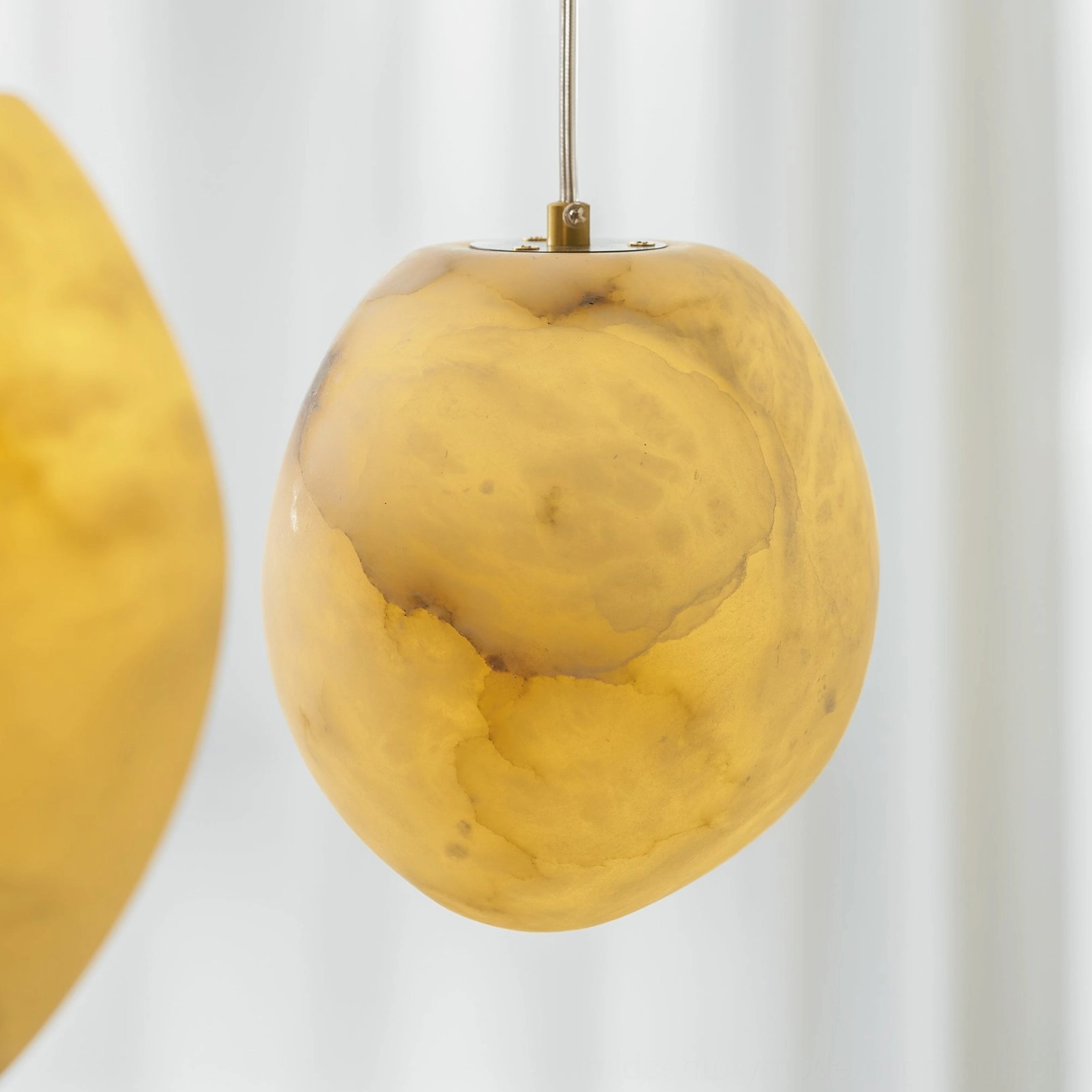 Galet alabaster pendant with warm white light interior glow