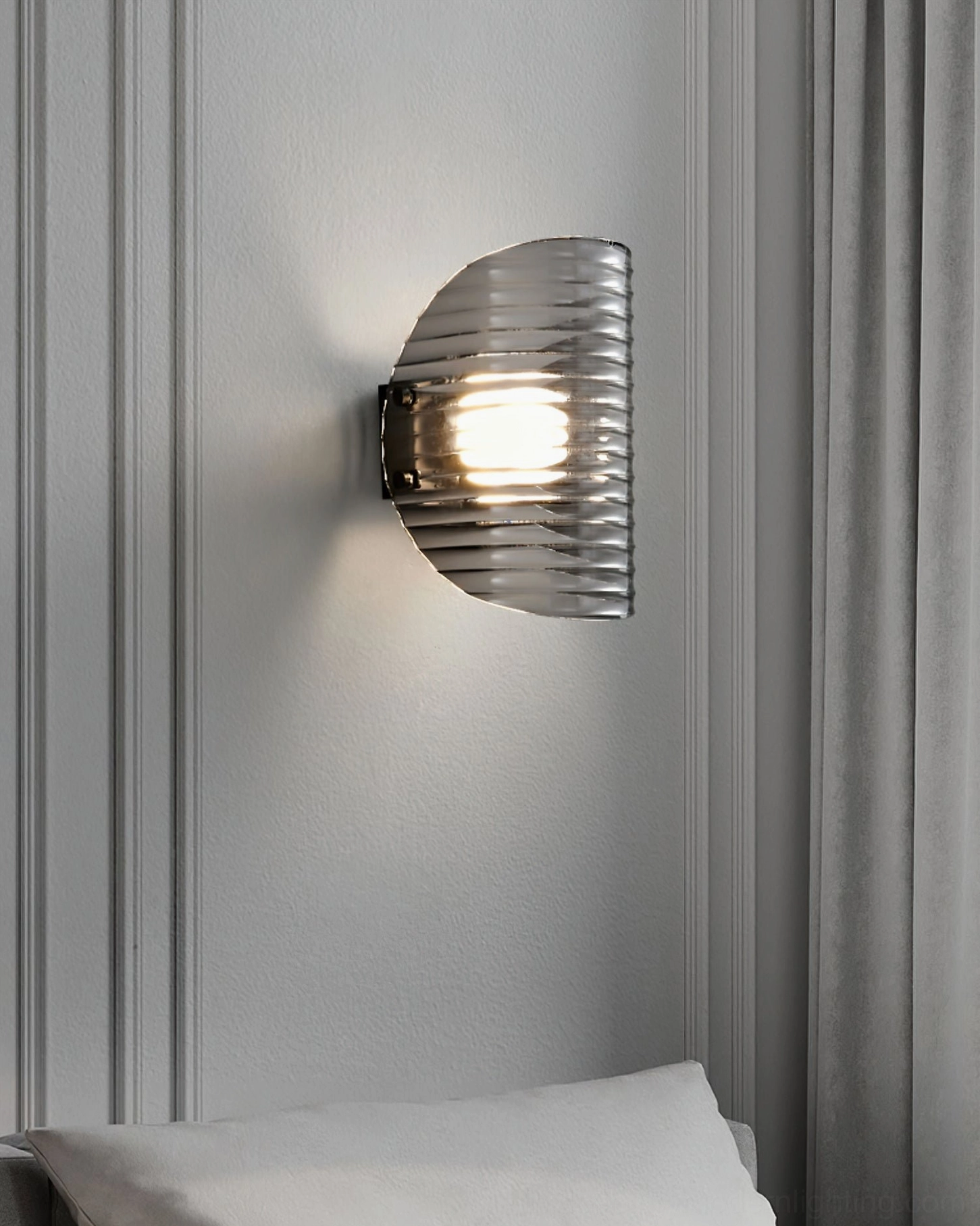 Gatsby mid-century modern wall lamp installed in bedroom with wainscot wall and throw pillow, minimalist home decor styling