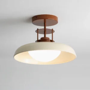 Gavin vintage-inspired semi-flush light fixture, illuminated cream shade with industrial metal hardware