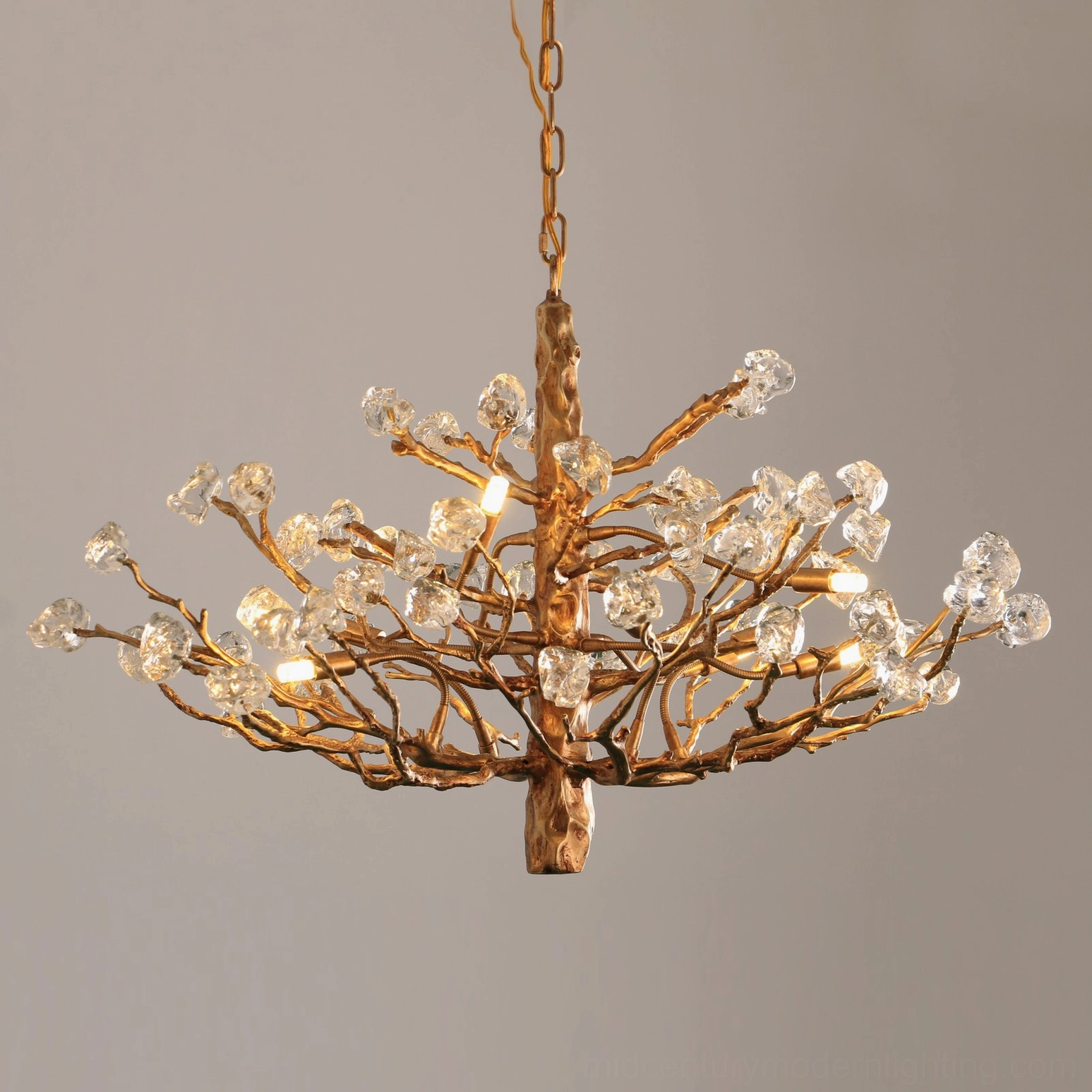 Gemstone branch chandelier multi-head configuration showing brass framework and glass stone artistry