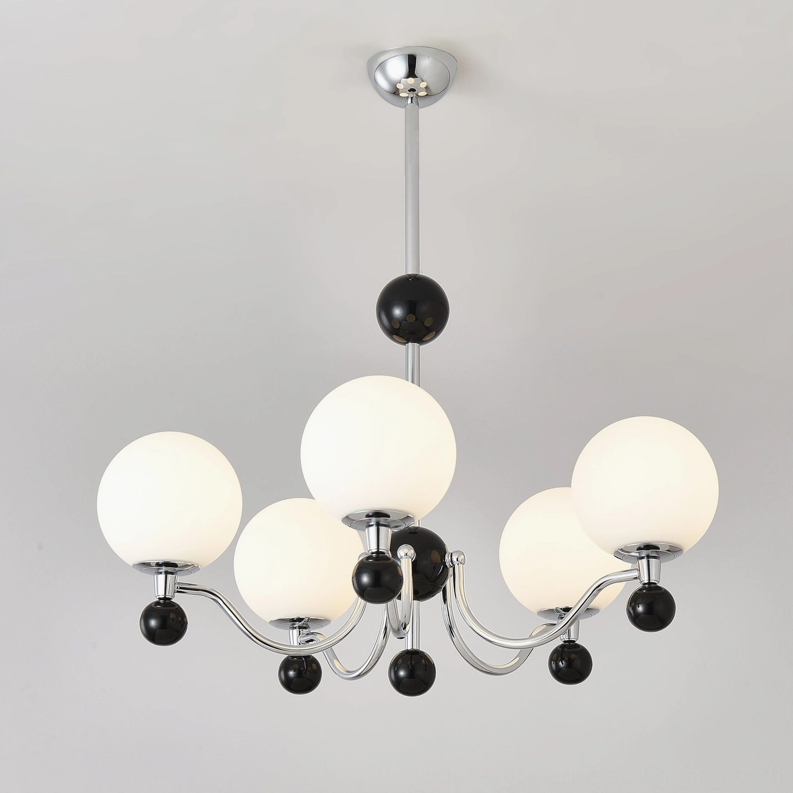 Multi-head geometric chandelier featuring polished chrome and frosted glass design elements