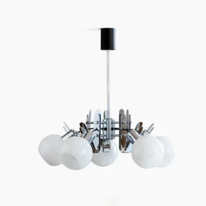Geometric chrome glass chandelier with three spherical opal shades viewed from above in studio lighting