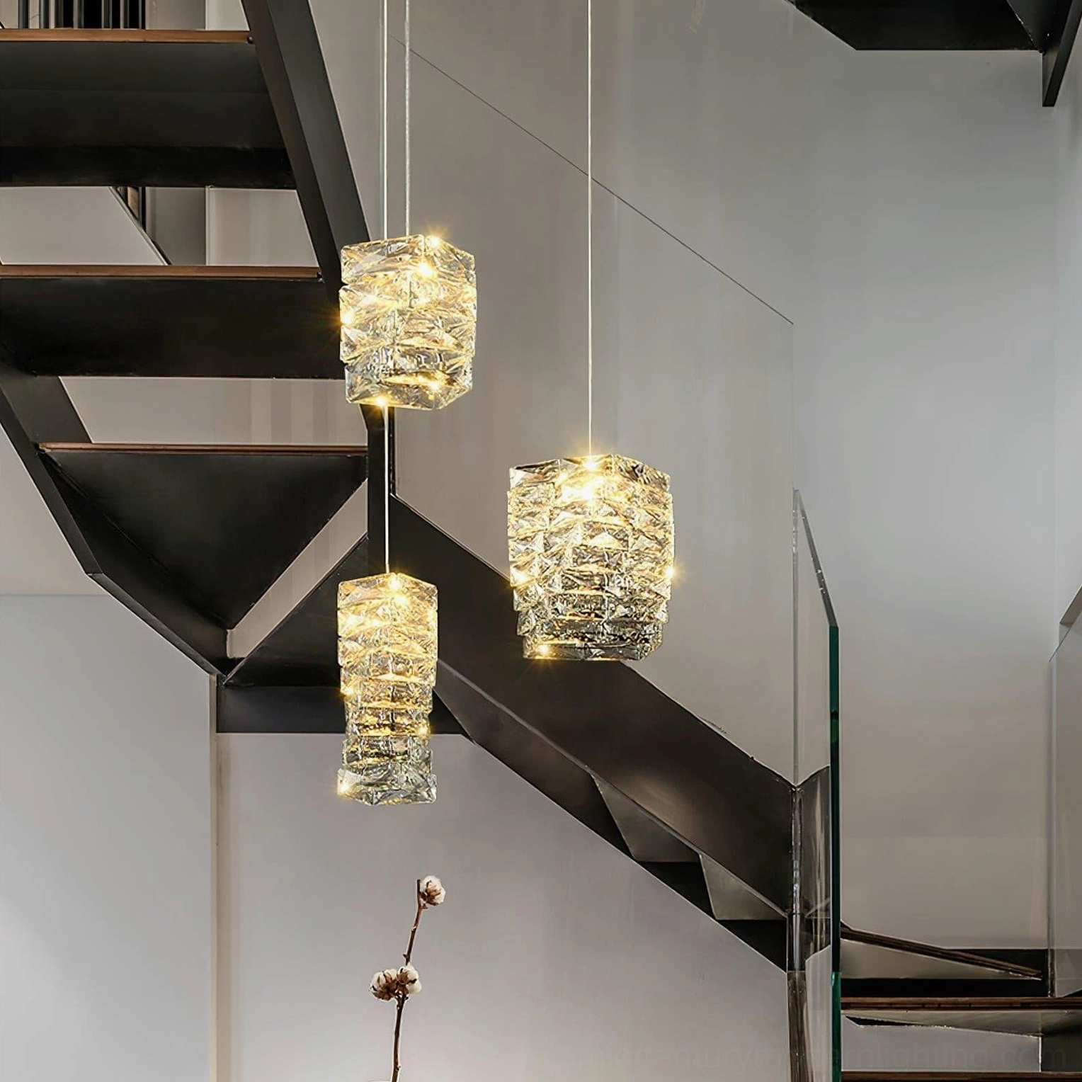 Geometric faceted crystal pendant light creating ambient illumination in modern interior design space