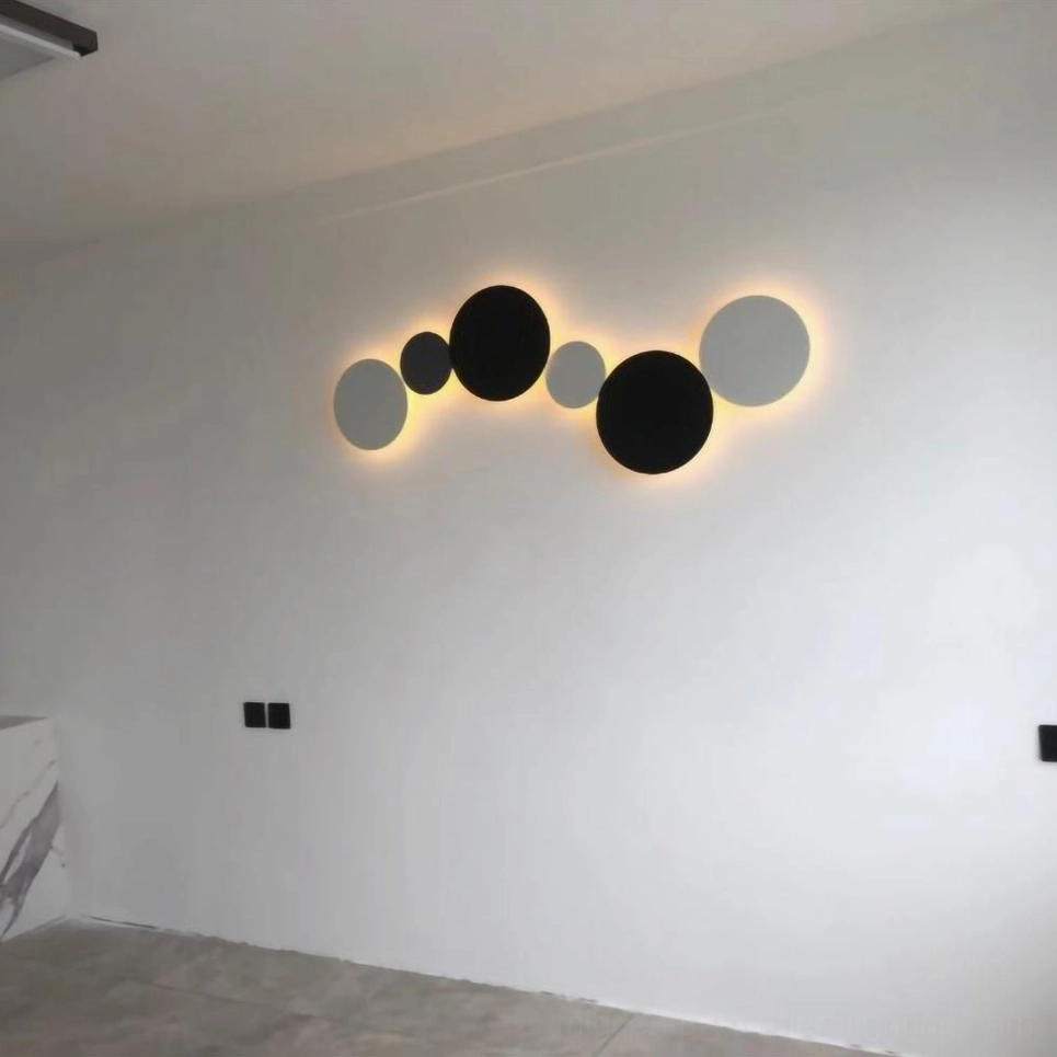 Modern geometric disc wall sconce installation showing dimensional layers and indirect lighting in contemporary interior