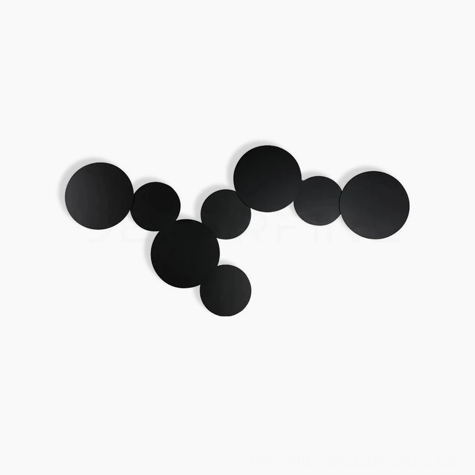 Geometric disc wall sconce with interlocking circular rings creating sculptural three-dimensional art lighting installation