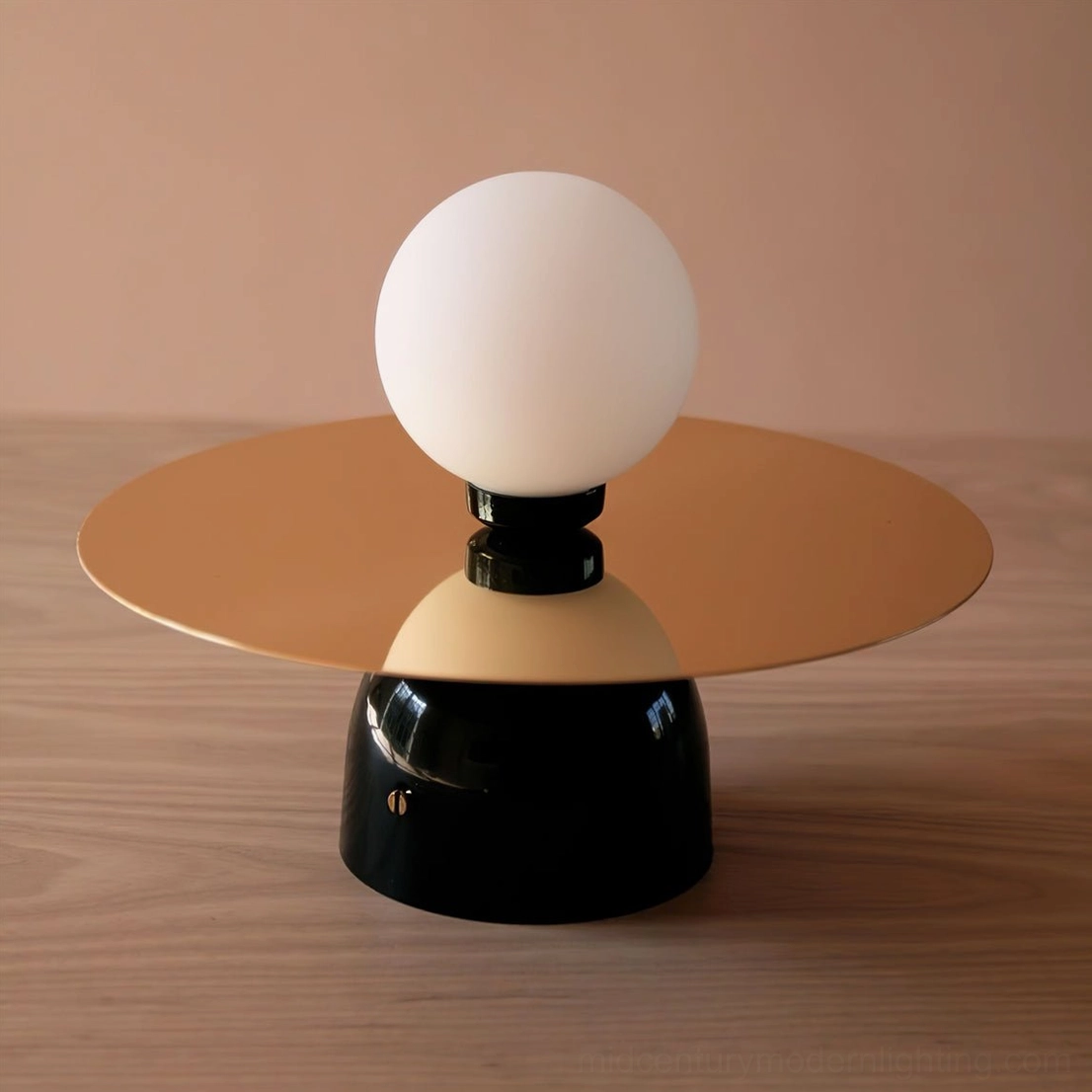 Frosted glass sphere and metal disc wall sconce showcasing geometric mid-century design