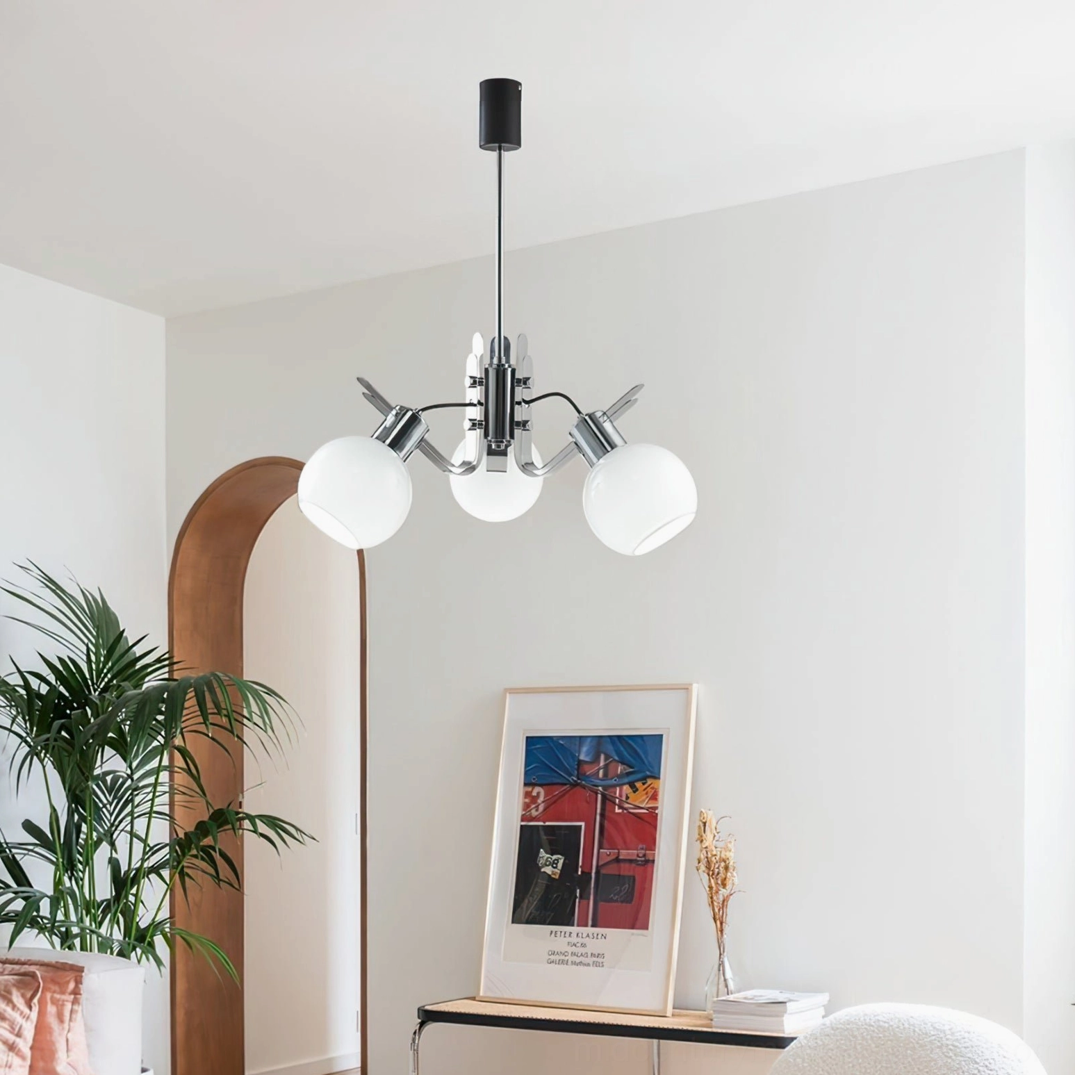 Geometric glass chandelier pendant displaying opal glass translucency with warm interior lighting