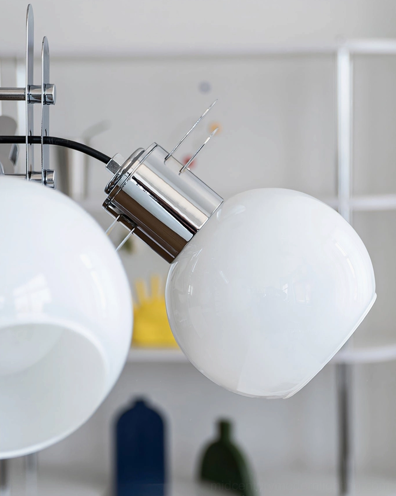 Single geometric glass lamp shade with chrome socket and mounting hardware on white background