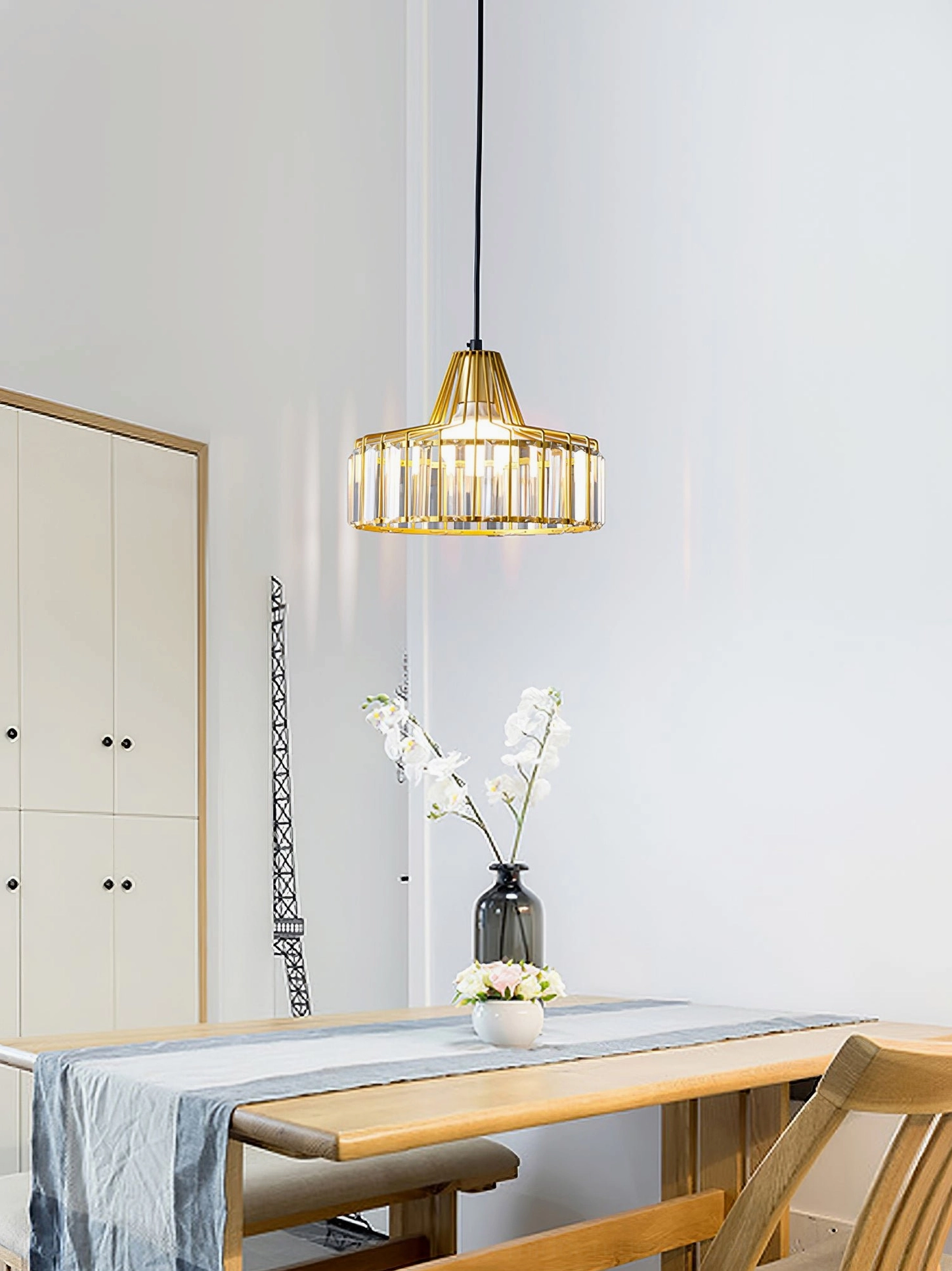 Crystal pendant light fixture showing geometric metal cage design and crystal arrangement