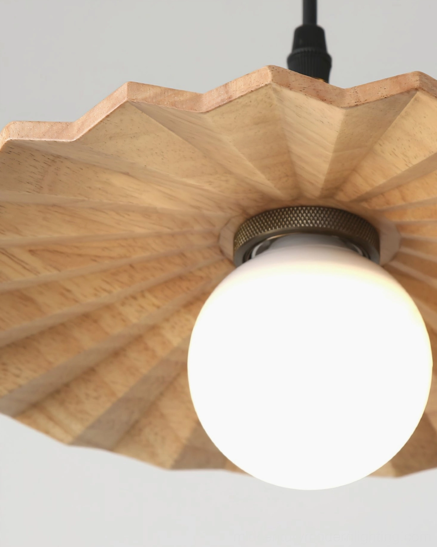 Natural wood geometric pendant light showing fine craftsmanship and wood grain texture of precision-cut shade