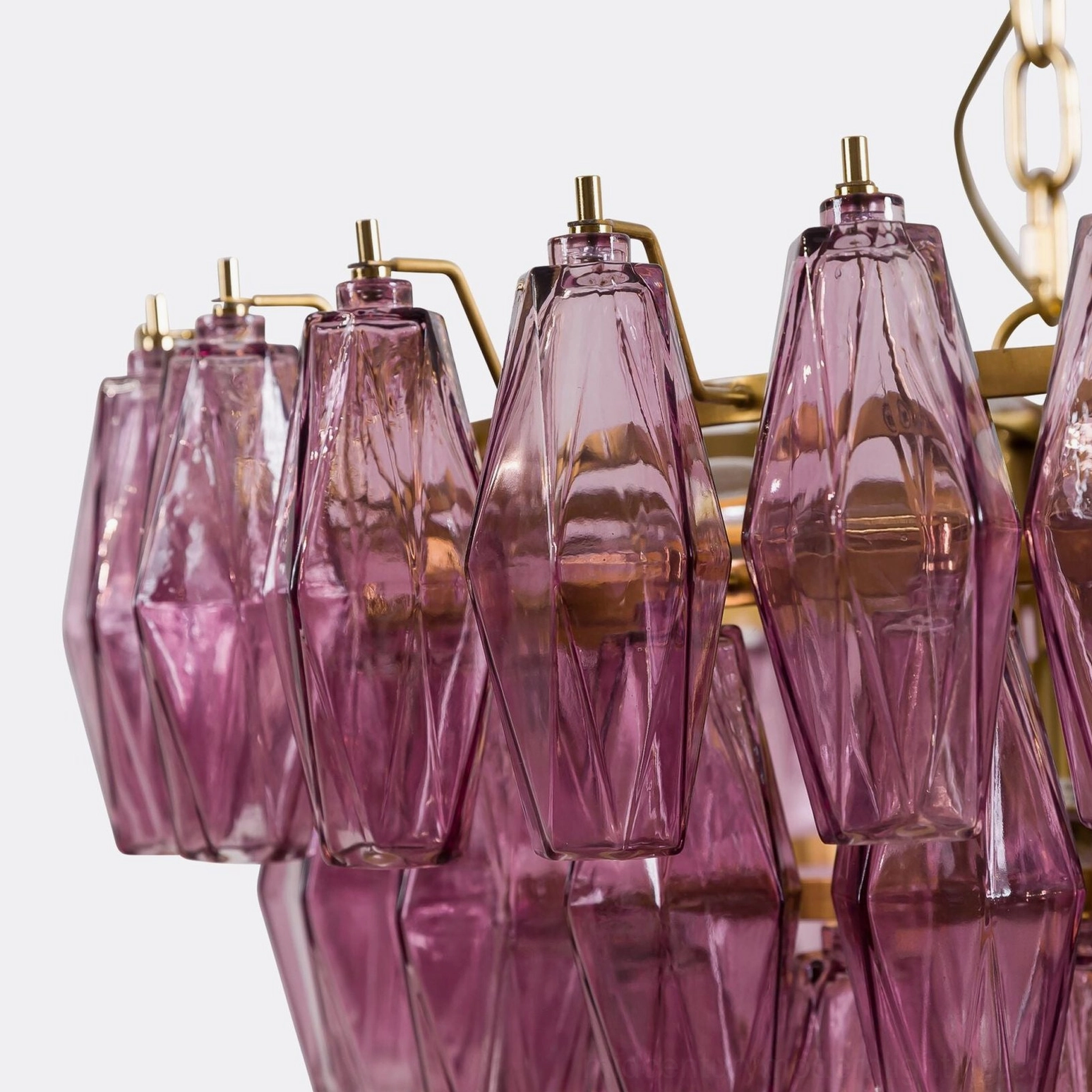 Geometric crystal prism chandelier showing layered faceted glass construction technique