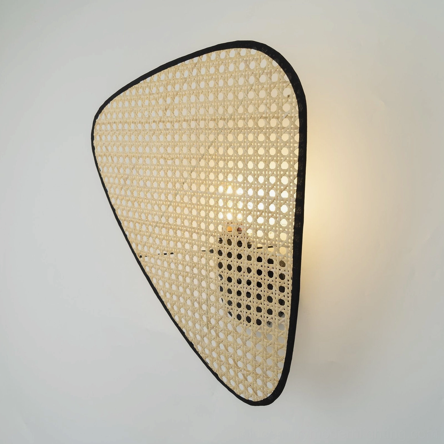 Geometric woven rattan wall lamp luxury contemporary interior design sculptural element