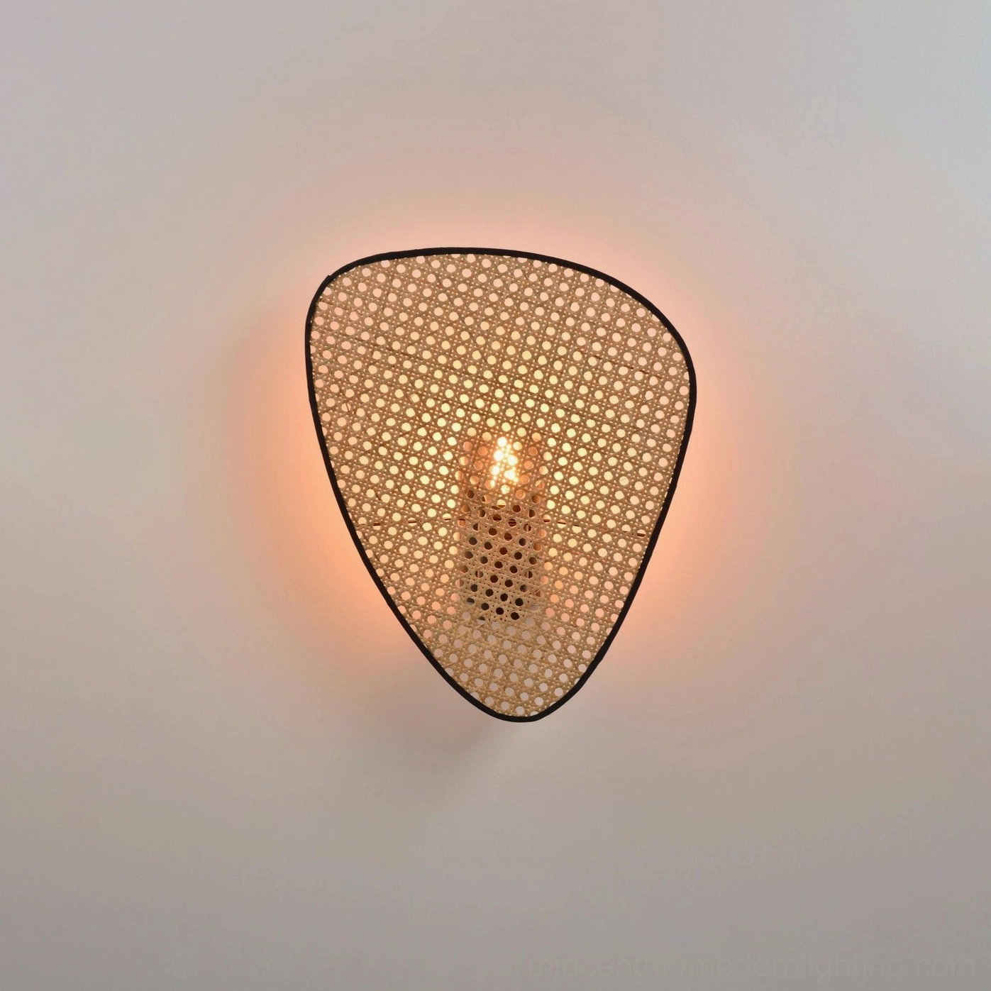 Geometric woven rattan wall lamp displaying floating mobile-like design and natural bamboo finish