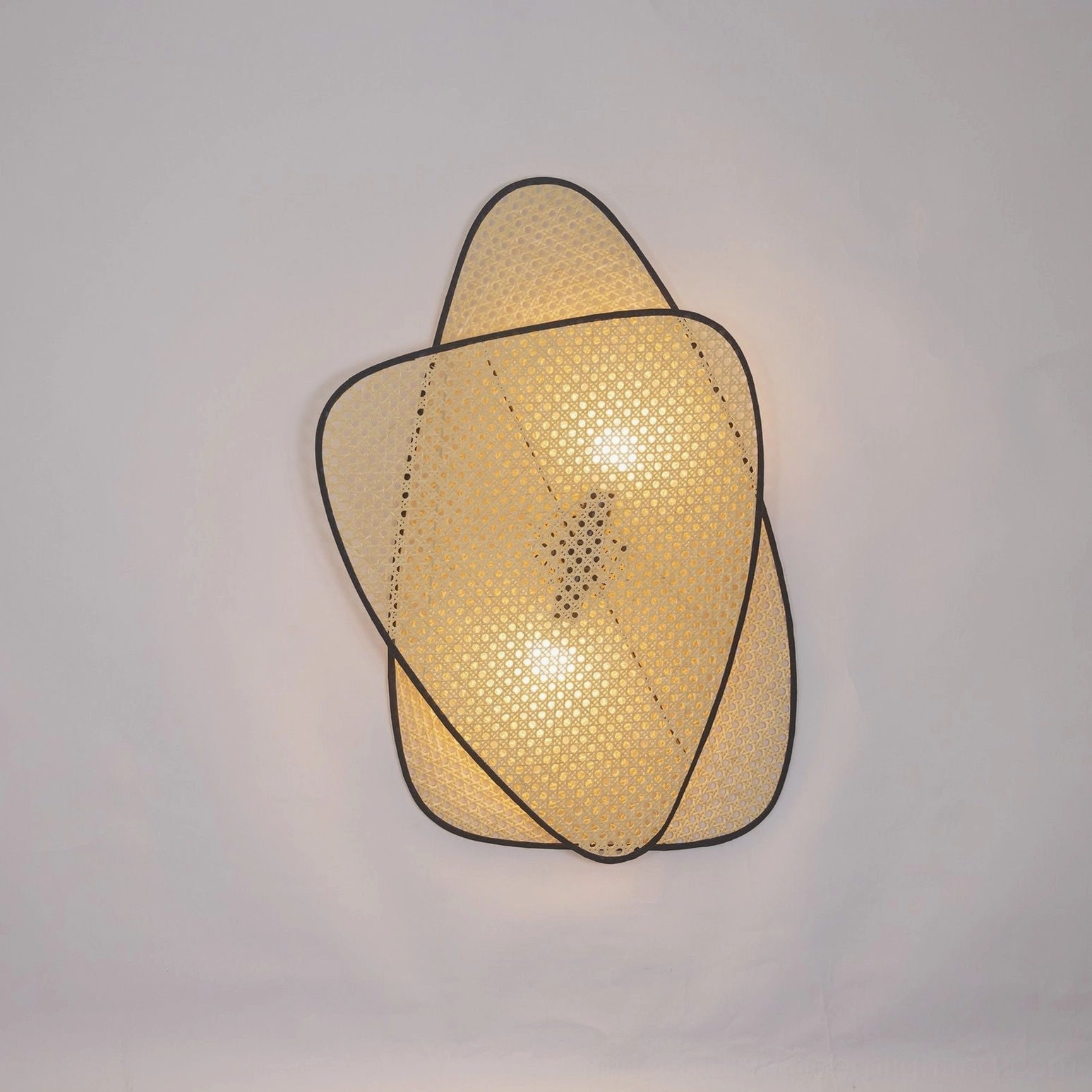 Geometric woven rattan wall lamp floating mobile design aesthetic artistic installation