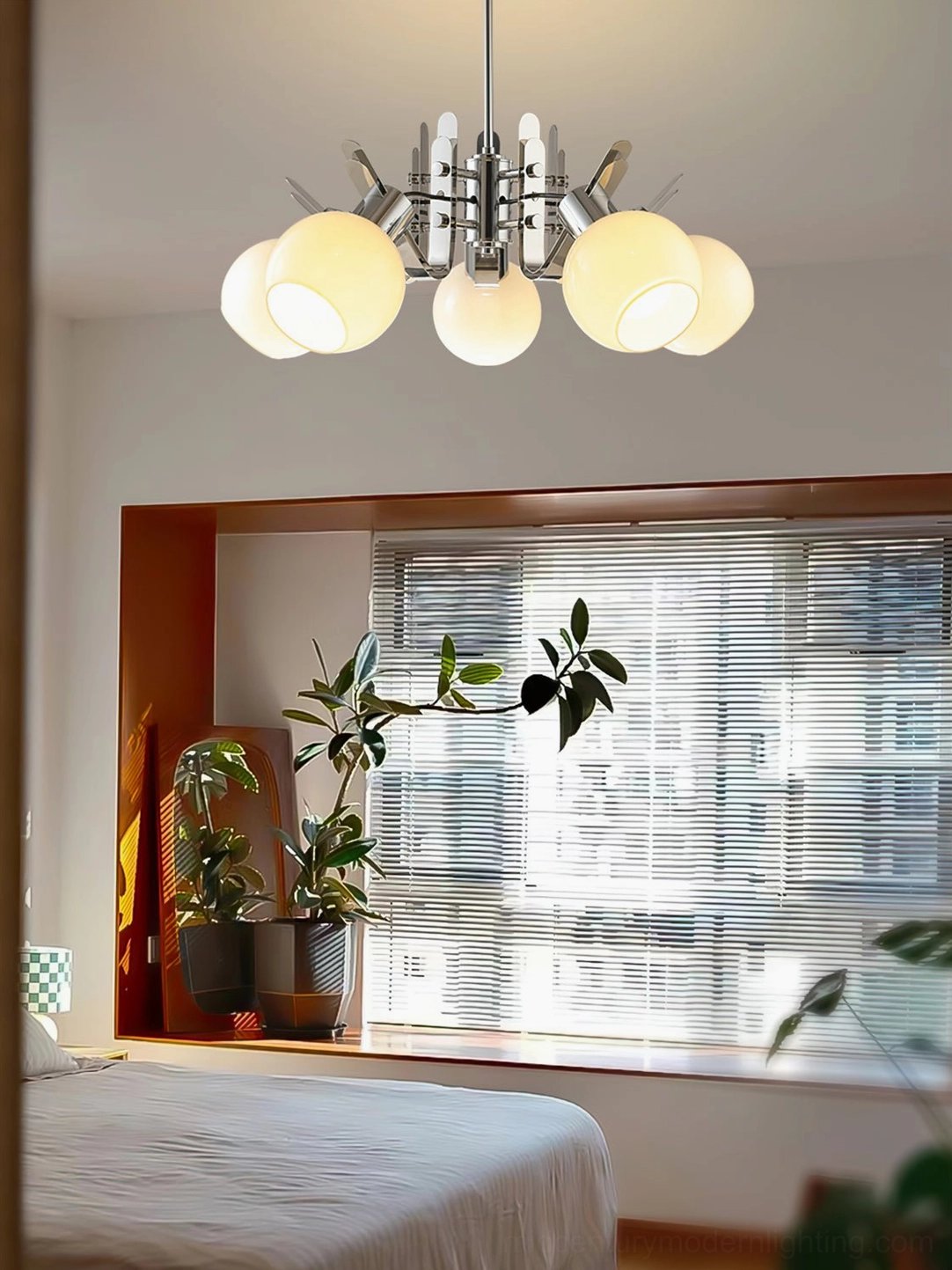 Geometric chrome glass chandelier showing spherical shade arrangement and polished metal framework detail