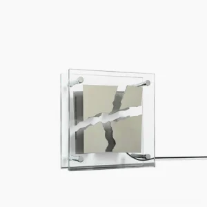 Modern square glass table lamp with geometric metal frame - front view showing clear glass panels and minimalist design