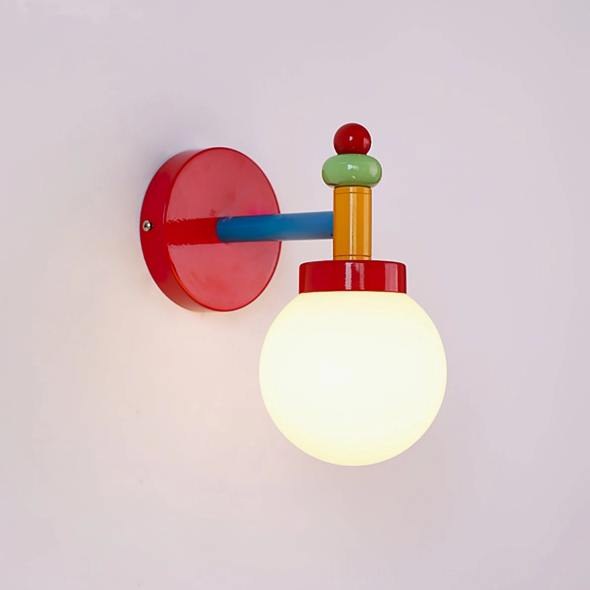 Vibrant color-blocked geometric wall lamp with frosted glass shade and metal connectors detail