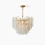Gevan gold crystal chandelier front view studio shot, tiered brass frame with cascading crystal pendants