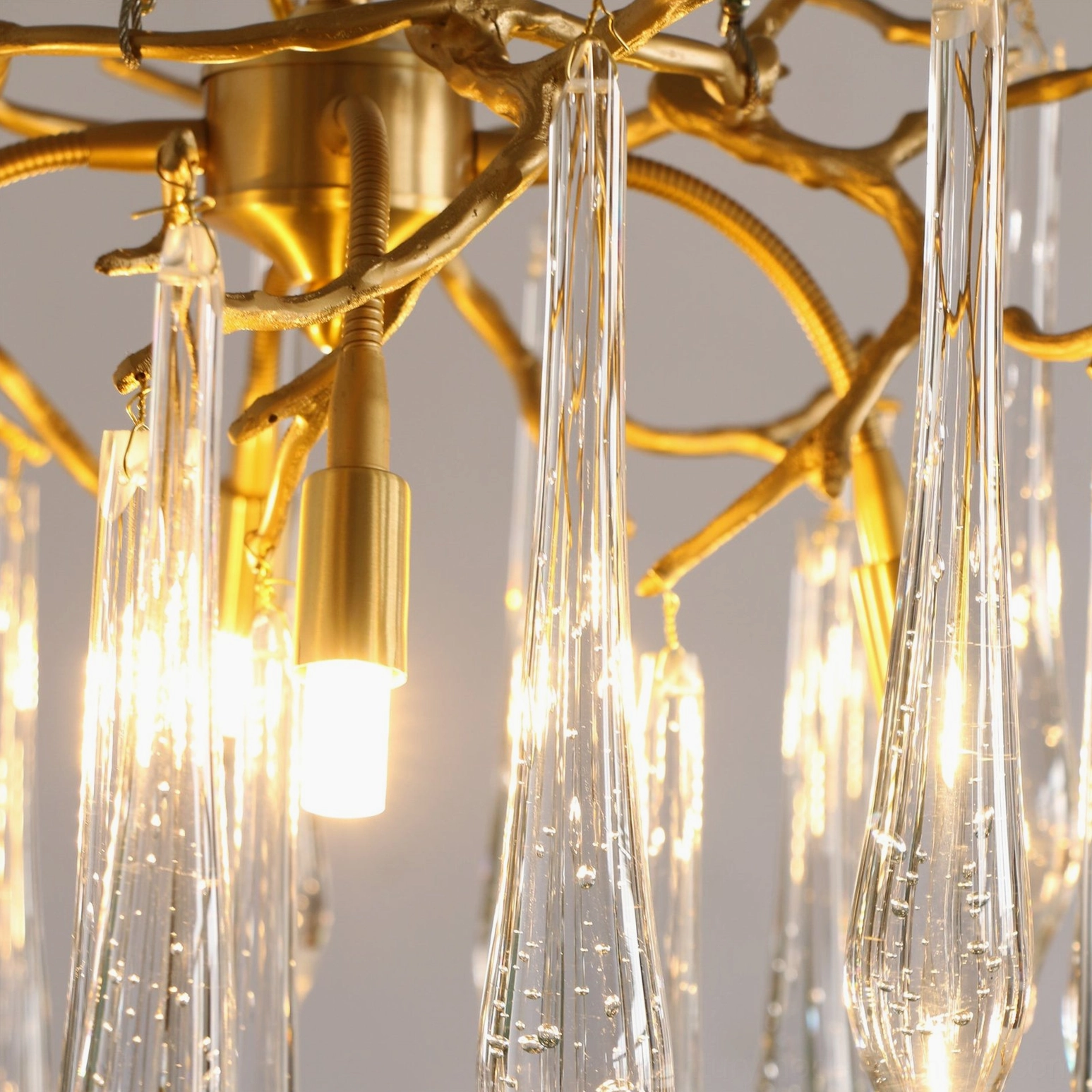 Close-up detail of Gieslinde Branch Chandelier water-drop crystal glass and brass frame