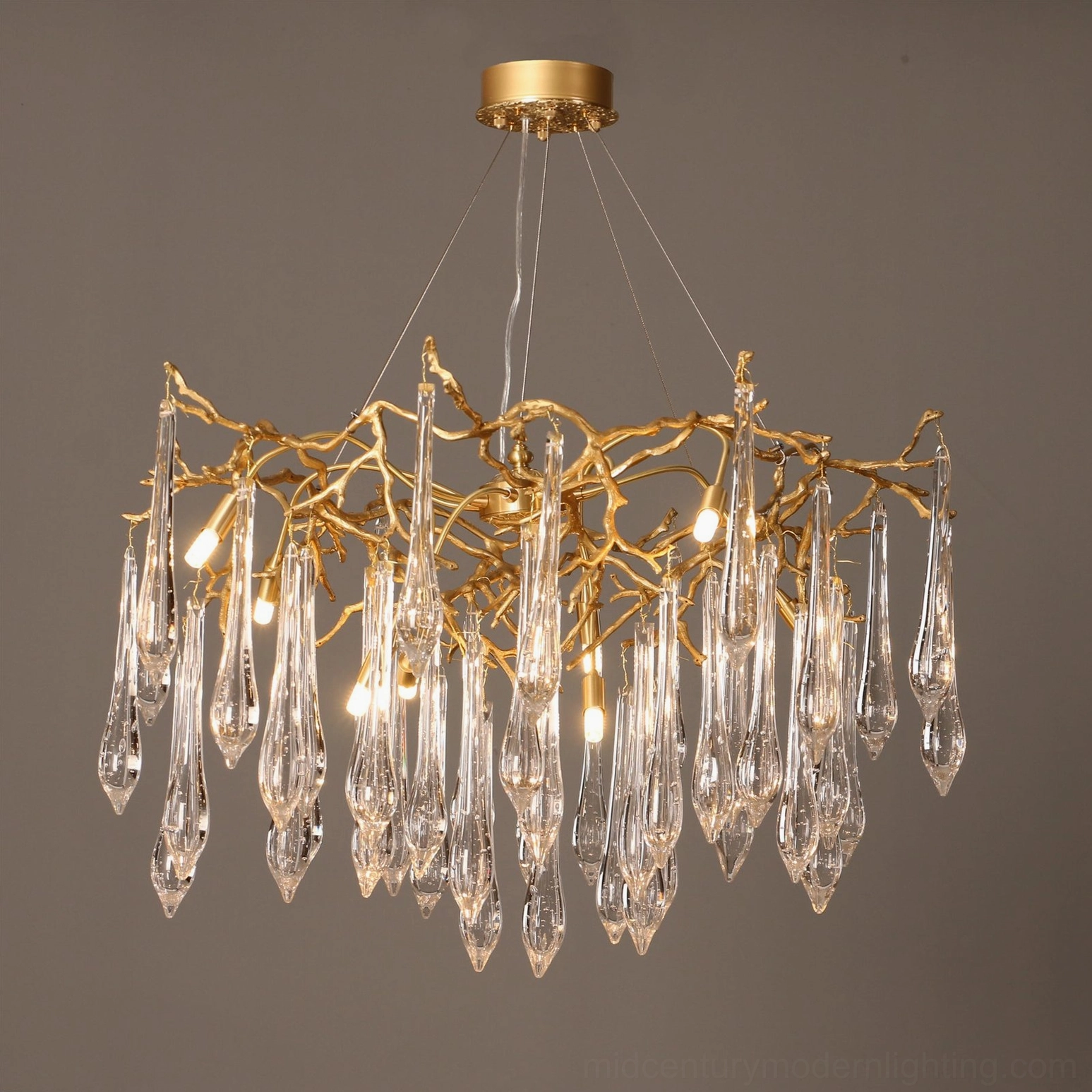 Full view of Gieslinde Branch Chandelier with lit bulbs and cascading crystal pendants