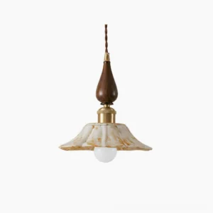 Gigaro ceramic pendant light with ruffled marbled shade, wood top, and brass hardware on white background