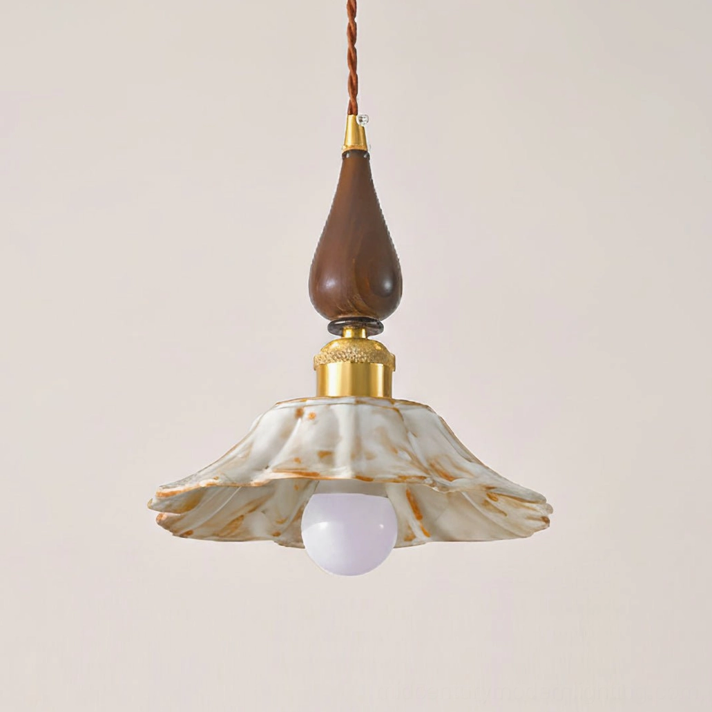 Artistic close-up of Gigaro ceramic pendant shade showing marbled texture and solid wood top hardware