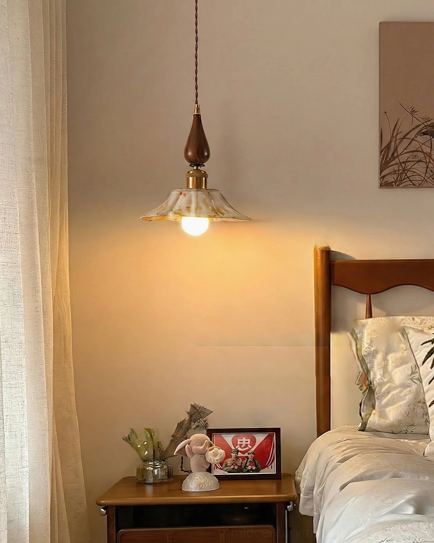 Cozy bedroom setting with Gigaro artisanal pendant light above nightstand and minimalist vintage decor