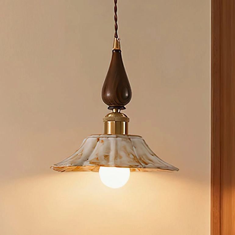Mid-century modern Gigaro pendant light with twisted cord, wood grain hardware, and vintage brass accents