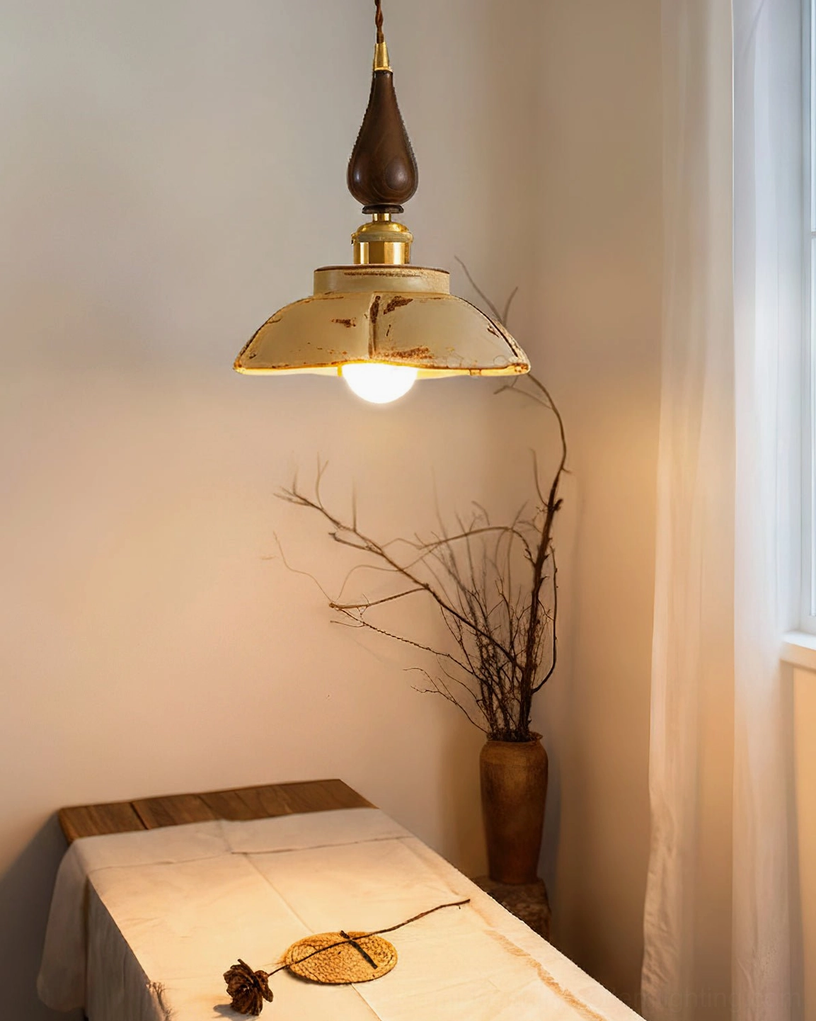 Distressed brass Gigaro pendant light with ruffled metal shade over dining table in retro interior