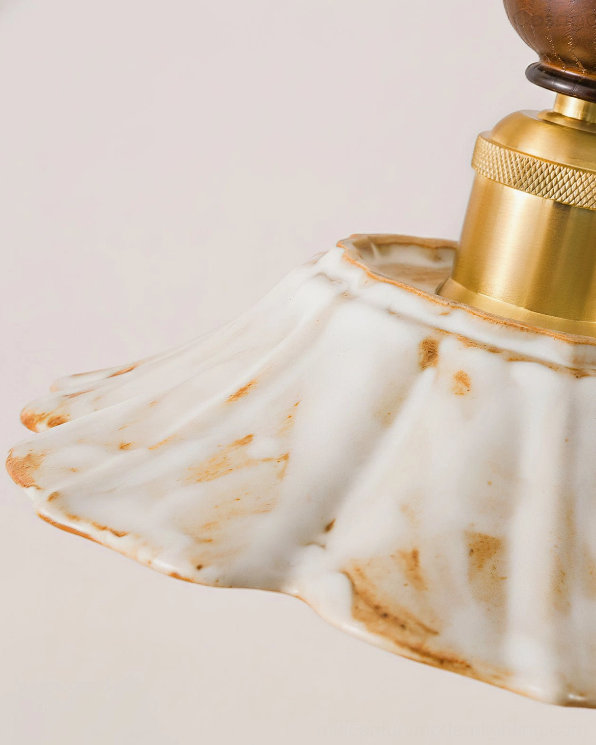 Gigaro mid-century modern ceramic pendant light with warm walnut finish and brass accents, studio shot