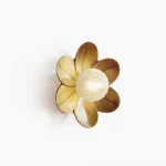 Gigi floral wall sconce with gold brass petals and frosted glass diffuser, front studio view